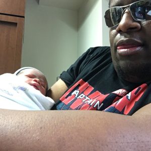 Jamie holding newborn Jayden in the hospital, 2016.